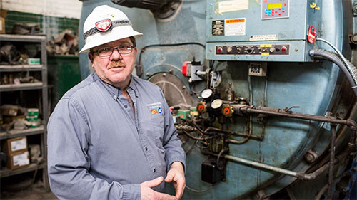 Blue Seal employee working the equipment